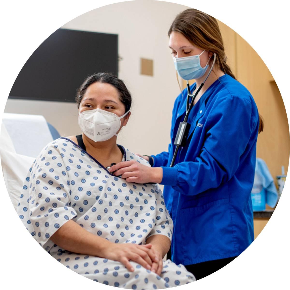 Student nurse with a simulation patient